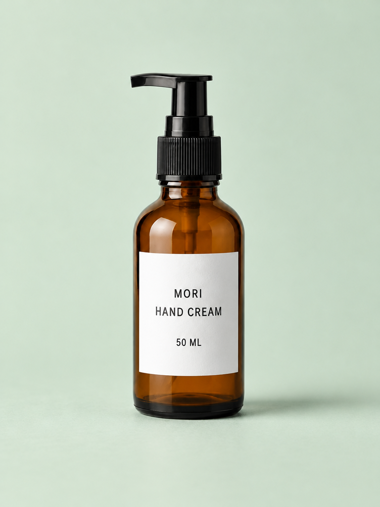 Flare requested condition, first output: amber MORI bottle with left-pointing black pump on a pale green background and surface.