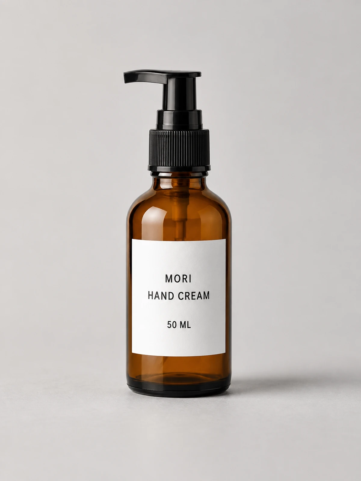 Fictional amber MORI hand cream pump bottle used as the fixed product-edit reference