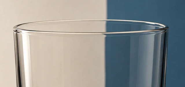 An exact crop of the empty tumbler's upper rim, showing the opening and side walls continuing downward.